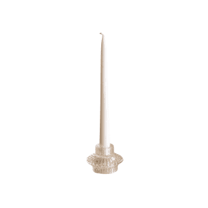 A white taper candle stands upright in the Bella 2 In 1 Candle Holder, which is transparent and textured, set against a plain white background.