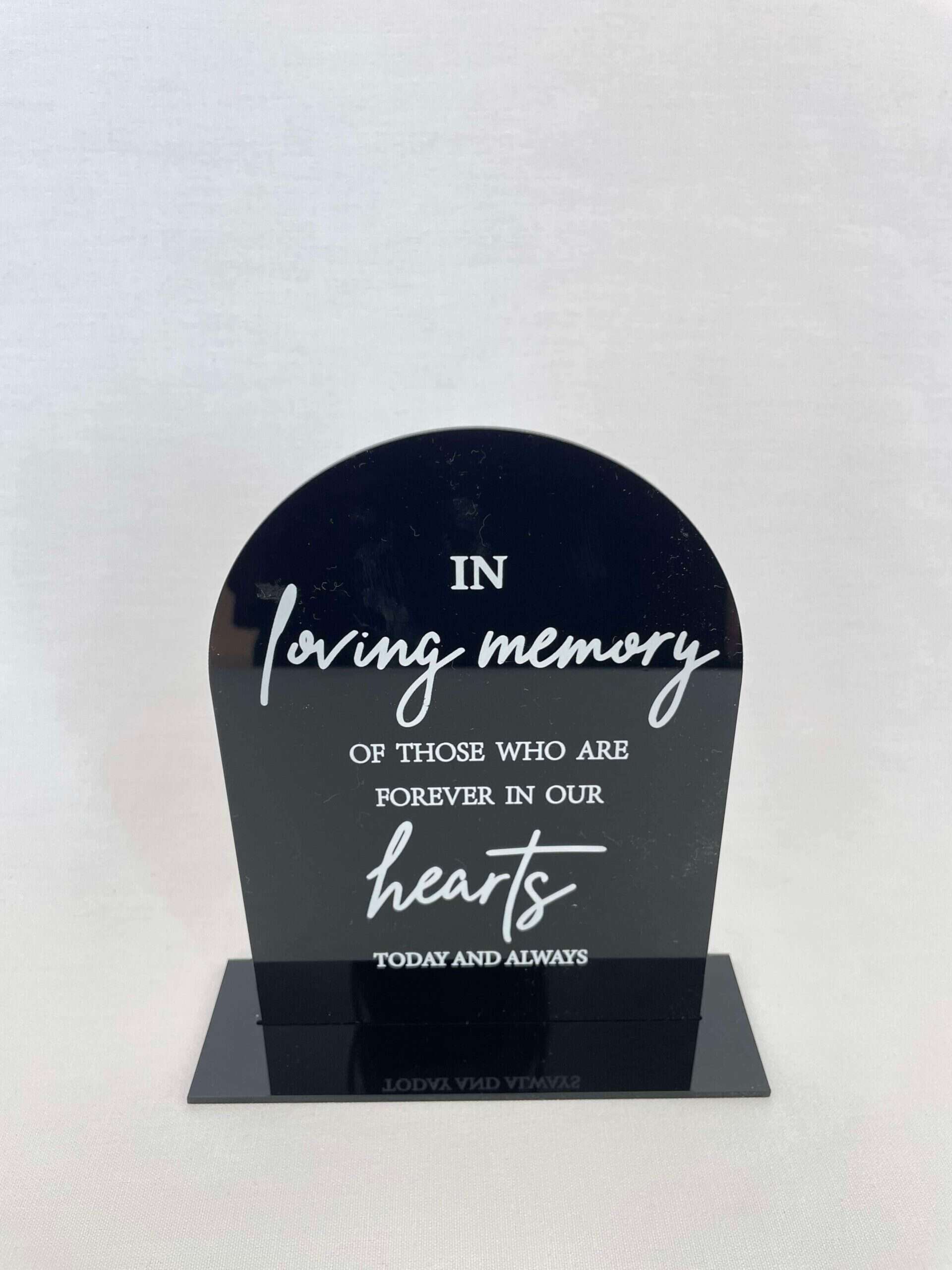 Enhance your Gold Coast wedding with the "Table Decoration l Card & Wishes" memorial plaque, featuring the heartfelt message "In loving memory of those who are forever in our hearts today and always," set against a plain background. Perfect for hire as a sentimental touch.