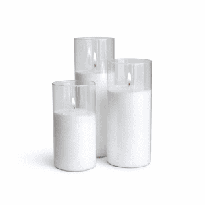 Three ribbed cylinder Candle Sand Holders of varying heights, each with a lit white candle, are grouped together on a white background—ideal for event hire Gold Coast or stylish wedding hire Sunshine Coast.